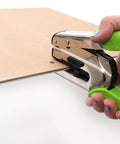 Crop-A-Dile Power Punch for one quarter inch holes scrapbooking tool in use, punching through thick chipboard with green handles