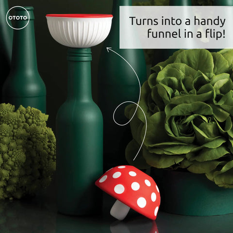 Cool Mushroom Shaped Silicone Funnel Foldable Kitchen Tool on green bottles with plants in background
