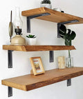 Heavy Duty L Brackets For Countertops 16x10x2 In Solid 5mm Thick Shelf Brackets With Hardware Included Matte Black 2 Pack Built For Beefy Loads And Everyday Use, supporting wooden floating shelves with decor in a room.