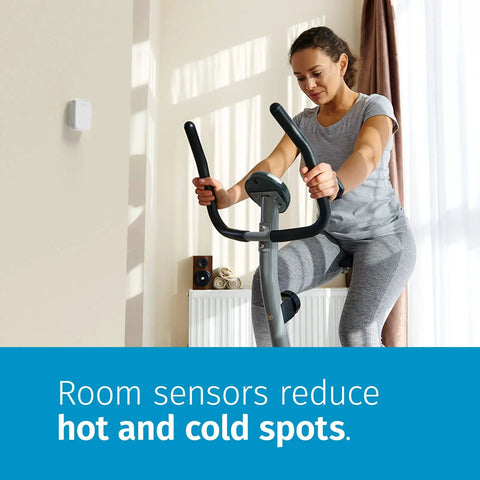 Woman exercising near wall-mounted Room Sensor For Smart Thermostat With Touch 2 Compatibility, Prioritized Comfort.