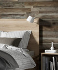 Bedroom wall featuring Driftwood Peel And Stick Vinyl Wall Planks For Easy Self Adhesive Wall Panels Waterproof Lightweight And Flame Rated 12 Pieces Covering 18 Square Feet Per Box Real Wood Texture For Quick DIY Remodel behind a bed.