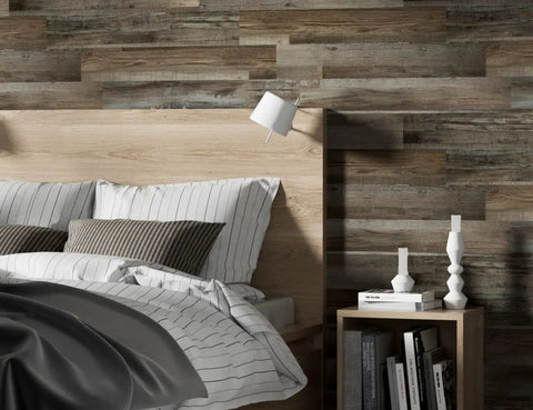 Bedroom wall featuring Driftwood Peel And Stick Vinyl Wall Planks For Easy Self Adhesive Wall Panels Waterproof Lightweight And Flame Rated 12 Pieces Covering 18 Square Feet Per Box Real Wood Texture For Quick DIY Remodel behind a bed.