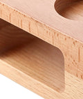 Natural wood espresso tamper station close-up, showcasing cutout for dosing needle, focusing on durability and design details.