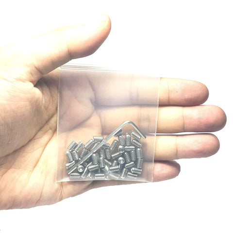 Hand holding 50-piece 8-32 x 1/4 inch stainless steel Allen head set screws with 5/64 inch Allen wrench, hex socket grub screws in a bag.