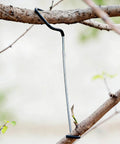 Fruit Tree Limb Spreader Set Of 20 7 Inch Branch Puller with plastic hose wrapped iron wire installed on tree branch.