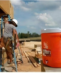 Construction site with orange cooler featuring Spigot Replacement Kit For Push Button Water Coolers No Fuss Easy Install 1 Pack