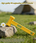 Camping Tent Stake Hammer With Puller Ultralight Nine Point Eight Four Inch Mallet Yellow PE Plastic Handle on ground
