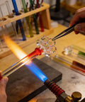 Glass artist shaping a tube from the Dope 20 Piece Set Of 12 Inch Borosilicate Glass Tubes With 12 Mm Outer Diameter For DIY Projects