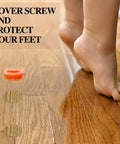 Child's feet beside Wood Grain Adhesive Screw Hole Cover Sticker Set, 648 Pieces, 12 Colors, waterproof PVC caps on wood floor.