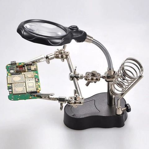 4X LED Magnifier Soldering Station With Light, Adjustable Stand and Auxiliary Clips holding a PCB for detailed work.