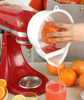 Stand Mixer Juicer Attachment With Two Size Reamers For Fresh Citrus Juice used on red KitchenAid with grapefruit juicing
