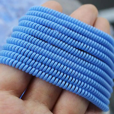 Blue spiral cable protectors for Apple EarPods and wired headphones pet proof non chew assorted colors tangle free durable cord shield