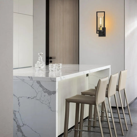 Set Of 2 Black Outdoor Wall Sconces 11 Inch Matte Finish installed in modern kitchen with marble counter and stools.