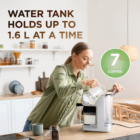 Smash Your Daily Grind With This Straight Up Smooth All In One Espresso And Cappuccino Coffee Maker featuring a woman filling the 1.6 L water tank.