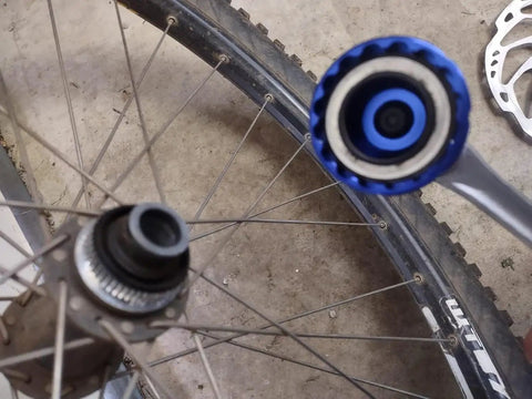 16-Notch Bottom Bracket Removal Tool For Shimano And More 44mm Centerlock BBT 69 2 Compatible tool in use on a bicycle wheel