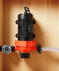 Heavy Duty 120V AC Diaphragm Water Pump mounted on wood with piping for garden irrigation and washing applications.