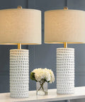 Modern 24.5 Inch Ceramic Table Lamp Set Of 2 With White Shades on white table, textured base in living room setting