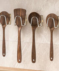 White Self Adhesive Wall Hooks That Stick Like Crazy No Drill Heavy Duty Towel Holder And Coat Hanger With Ultra Strong Waterproof Glue Easy Install displaying wooden spoons.