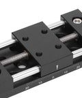 Close-up of Built Tough Aluminum X Axis Sliding Table with precision knobs and linear slide for micro adjustments.