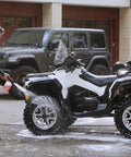 Man using Electric Pressure Washer 1600 PSI 1.7 GPM Portable Cleaner for Cars, Siding, Driveways, and Patio on an ATV