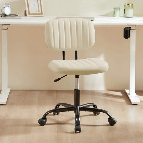 Small Armless Office Desk Chair With Comfy PU Leather Cushioned Seat And Lumbar Support, Height Adjustable Rolling Swivel Task Chair For Adults And Students, Perfect For Home Office Bedroom Vanity Beige White shown in a modern setting.