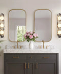 Natural Marble Bathroom Vanity Light, Alabaster 3-Light Wall Sconce next to mirrors in elegant bathroom setup with flowers.