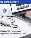 Built Different Rock Solid Compact Flash Memory Card 2GB Type I SLC NAND connected to a laptop via an adapter for reliable data transfer.