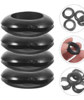 Heavy Duty Black Rubber Grommet Kit 4 Pack For Distribution Boxes Protect Cables With Flexible Heat Resistant Grommets For Wiring And Quick No Fuss Sealing Weatherproof Protection, four black rubber grommets stacked and shown in hand