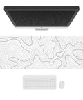 Extended XL White Gaming Mouse Pad With Stitched Edges Minimalist Topographic Map Desk Mat For Serious Gamers Pro Grade Anti Slip Base Large 31.5 By 11.8 Inch Mouse Pad For Keyboard And Mouse Durable Clean Look displayed on desk with keyboard and monitor.