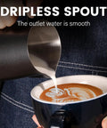 Close-up of 12Oz Stainless Steel Milk Frothing Pitcher With V Shaped Spout And Teflon Coating pouring milk into coffee cup