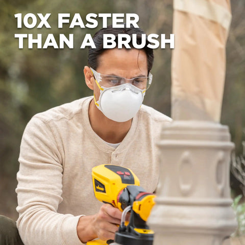 Man using 18V Cordless Paint And Stain Sprayer Delivering Slick HVLP Coatings for quick painting outdoors.