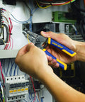 Person using Wire Stripper And Cutter 6 Inch With ProTouch Grips And Spring Assist Jaw for electrical wiring inside panel