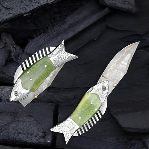 Fish Style Copper Damascus Folding Knife With Ladder Pattern Blade, brass engraved handle, open and closed on dark background