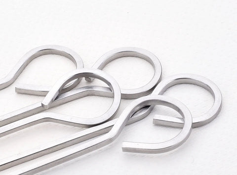 Close-up of stainless steel 10-inch square barbecue skewers with ring handles, 12-pack.