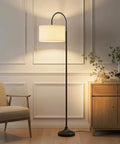 Nora Arc LED Tall Floor Lamp With Heavy Base For Living Room And Office, sleek black design in cozy bedroom setting