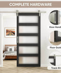 Glass Barn Door 42x96 Inch With 5-Panel Frosted Glass, Solid Wood Frame Wrapped In Waterproof PVC Surface, Black Finish, 7-Foot Nickel Sliding Door Hardware Included displayed installed in a room.