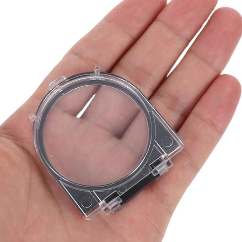Clear Push Button Switch Protector Guard No Sweat Easy Install Safety Cover held in hand, transparent plastic material
