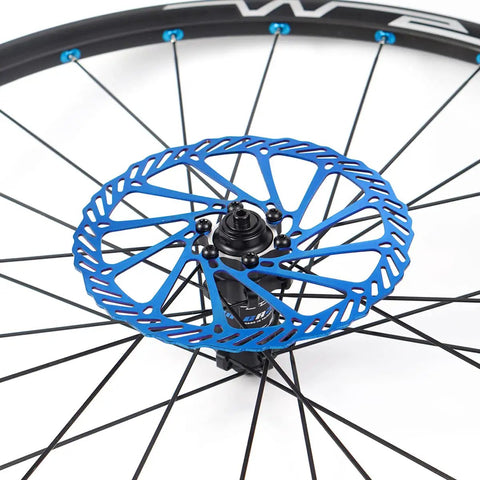 MTB Disc Brake Rotors Set 160mm 180mm 203mm 2 Pieces With 12 Screws Stainless Steel 2mm Thick 44mm Bolt Circle Blue Finish For Mountain Bikes Built For Dope Trail Riders shown mounted on a bike wheel