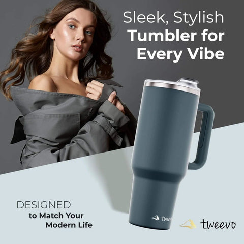40 Oz Stainless Steel Tumbler With Handle And Straw For On The Go Hydration, Double Wall Vacuum Insulation Keeps Drinks Cold Or Hot Longer, Sweat Proof Easy Grip, BPA Free And Dishwasher Safe, Charcoal, displayed with woman in stylish coat.