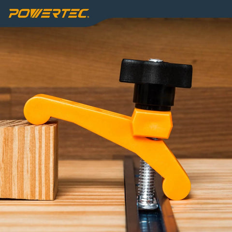 Two Pack Mini Hold Down Clamps For T Track Systems Three And A Quarter Inch Long By Three Quarters Inch Wide Includes Two And A Half Inch T Track Bolts Thumb Knobs And Swivels Ideal For CNC Machines Table Saw Sleds Drill Presses And Workbenches installed on wooden surface.