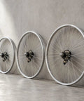 Slick Single Speed Rear Wheel Rim With Heavy Duty Aluminum Hub And Plug In Brake Assembly For No Sweat Bike Repair and Rock Solid Stopping Power Built To Roll All Week Long, displayed in three units.