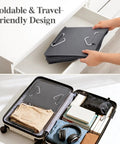 Person organizing Foldable & Travel-Friendly design storage solution in suitcase with jeans, books, and headphones.