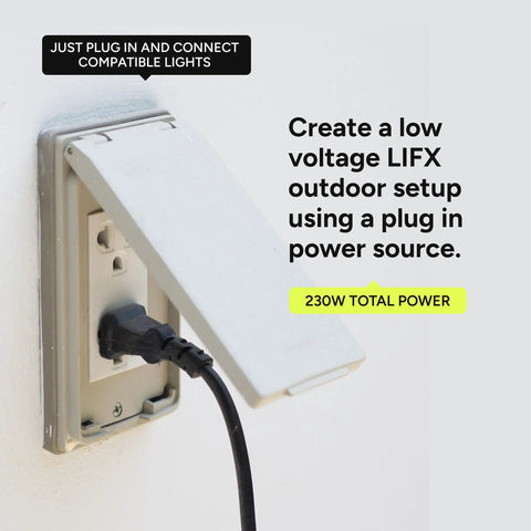 Wall outlet with Outdoor Landscape Low Voltage Plug In Power Supply Kit, cable plugged in, lid closed.
