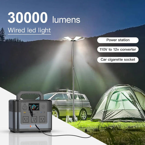 30,000 Lumen Telescoping Camping Light With Remote And Manual Control illuminating car and tent at night