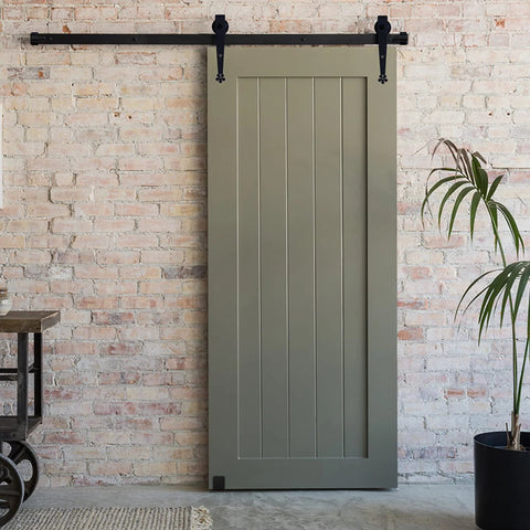 Sliding door on wall using a 2 pack solid U shaped guide wheel set with flush flat bottom for sliding doors and cupboards, matte black finish.