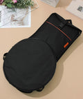 Dang Tough Dumb Drum Carrying Case Stitched From Heavy Gauge Waterproof Oxford Material To Store Percussion Equipment Safely And Keep Things Slick While You Cruise Down The Interstate In Solid Black with a circular design and pockets.