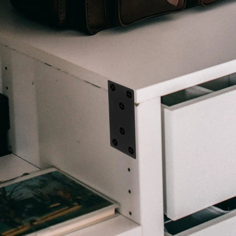 Stainless Steel Black Corner Brackets Kit on white cabinet for support and durability