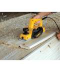 Person using Beast Five Point Five Amp Hand Planer with 3-1/4 inch cutter on wooden board for a smooth finish