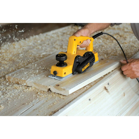 Person using Beast Five Point Five Amp Hand Planer with 3-1/4 inch cutter on wooden board for a smooth finish