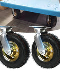 Rock Tough 10 Inch Swivel Caster Wheels Thick Pneumatic Rubber Tires for carts with metal base in industrial setting.